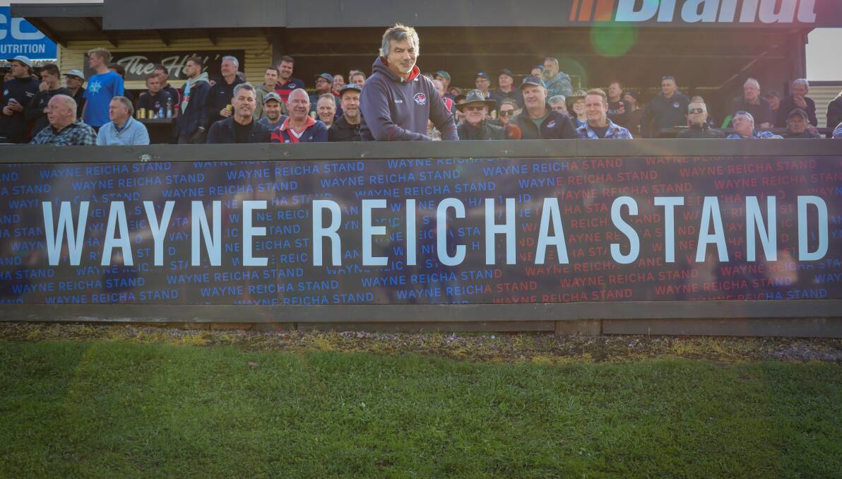 Wayne Reicha (middle) with family and friends in the new stand at Terang Recreation Reserve named in his honour. Picture by Justine McCullagh-Beasy 