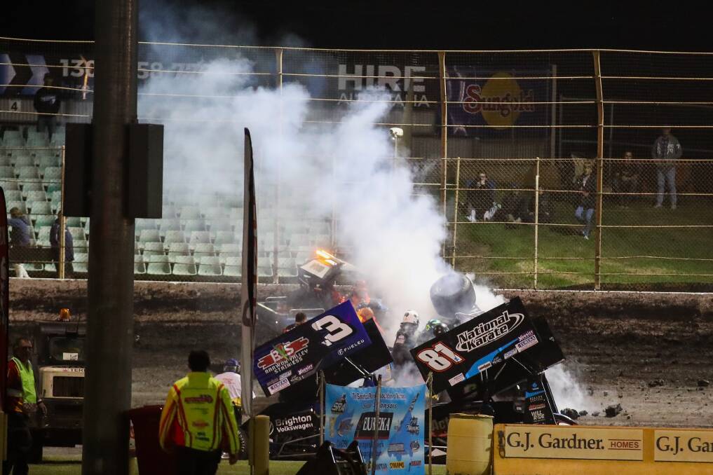 RACE DELAY: Smoke billows from Grant Anderson's car. Picture: Morgan Hancock 