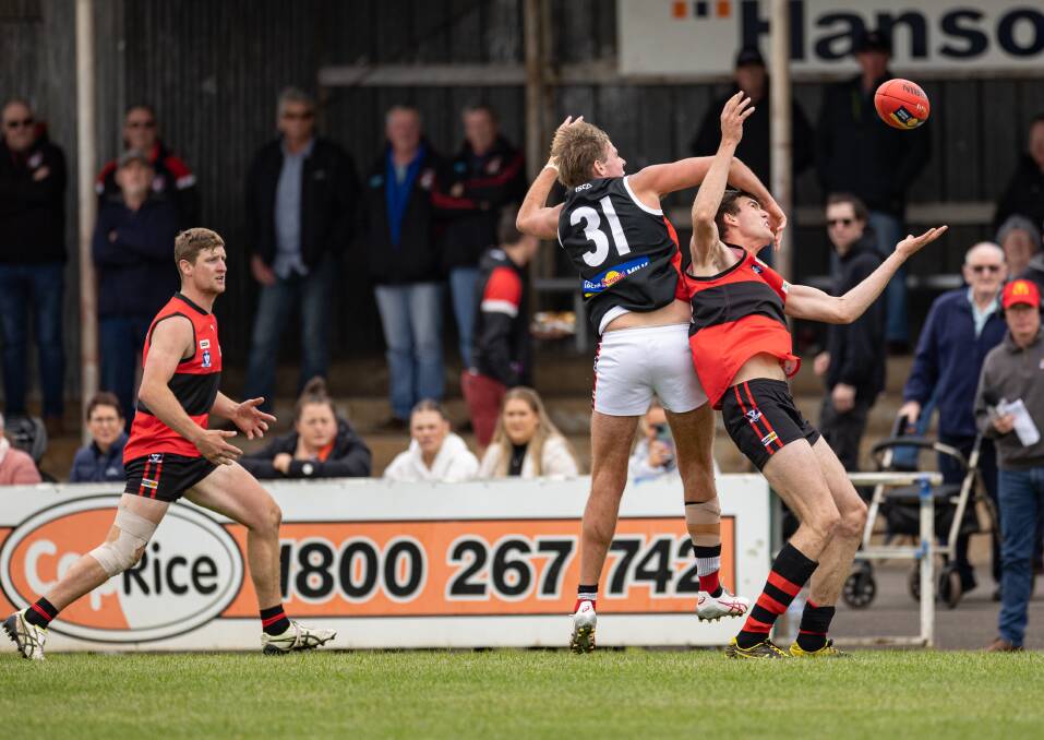 Mark Marriott (far right) in action for Cobden against Koroit in round one. Picture by Sean McKenna 