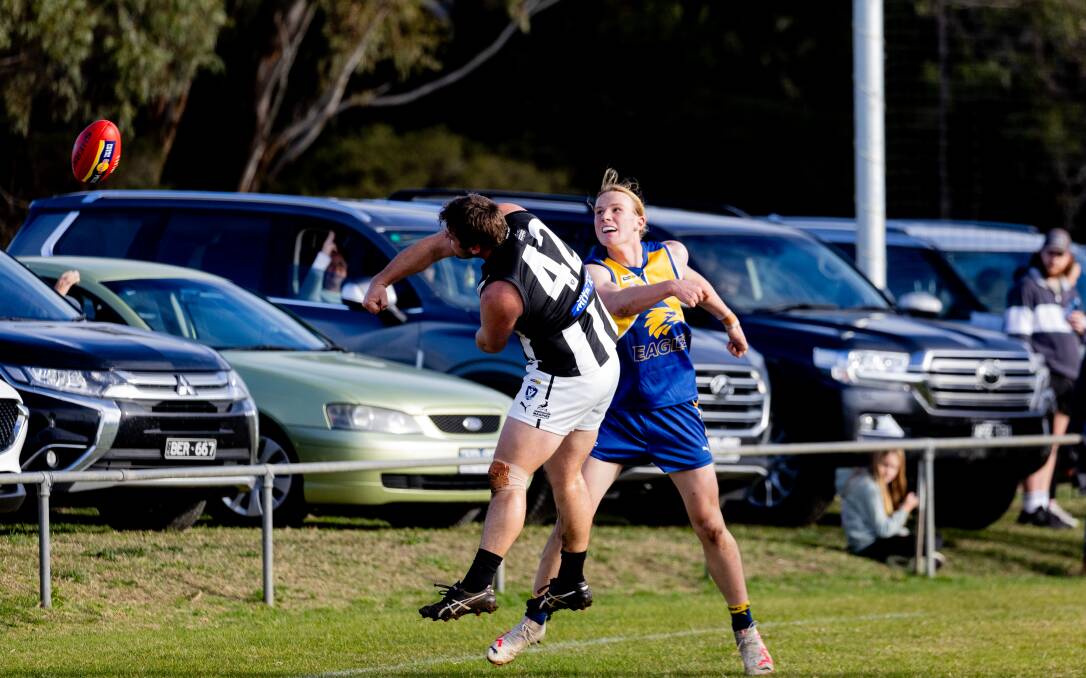 Camperdown's Luke O'Neil and North Warrnambool Eagles' Charlie McKinnon watch the ball fly through the air. Picture by Anthony Brady 