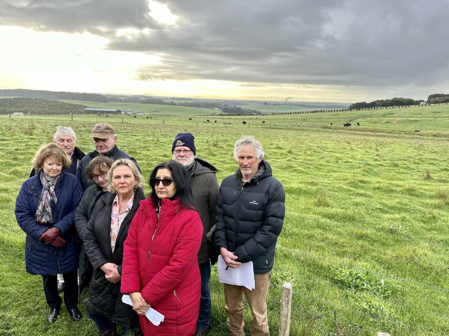 Neighbours John and Jenny Ryan, Chris McGrath, Helen Bourke, Julie Luxton, Sapna Mitra, Geoff Spencer and Garry Druitt say a mobile phone tower on Hopkins Point Road should be moved closer to the housing development that needs it.