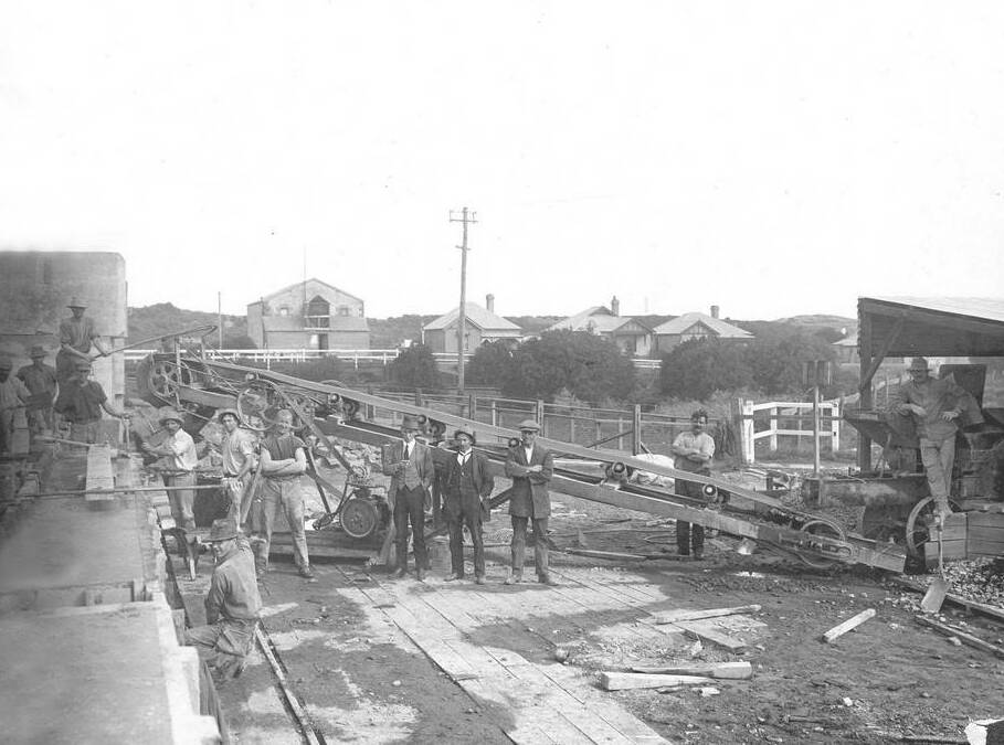 Workers along the Merri River where concrete blocks were made and carted to the breakwater.