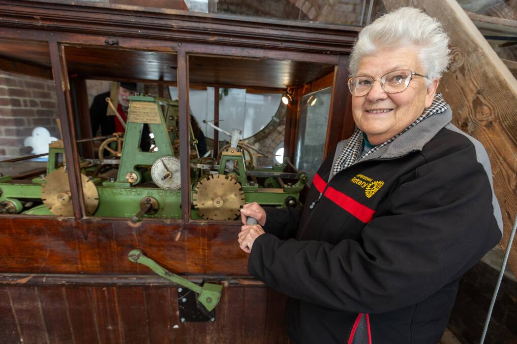 Camperdown Rotary Member Patricia Robertson in the clocktower which needs to be manually wound up every week to keep it running. The mechanism is identical to Big Ben in London, just smaller. Picture by Eddie Guerrero 