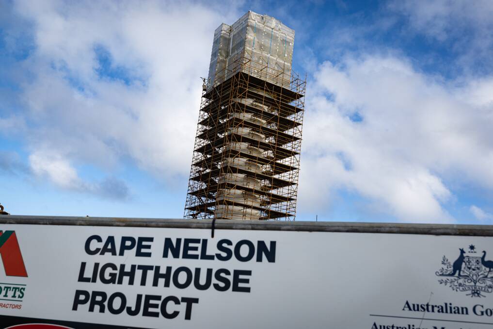 Scaffolding surrounds the outside of the Cape Nelson lighthouse.