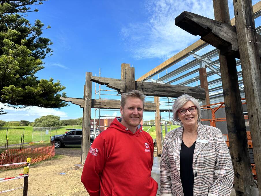 Bolden Constructions owner Leigh Dufty with mayor Debbie Arnott at the new amenity block where recycled timber beams from historic bridges have been installed.
