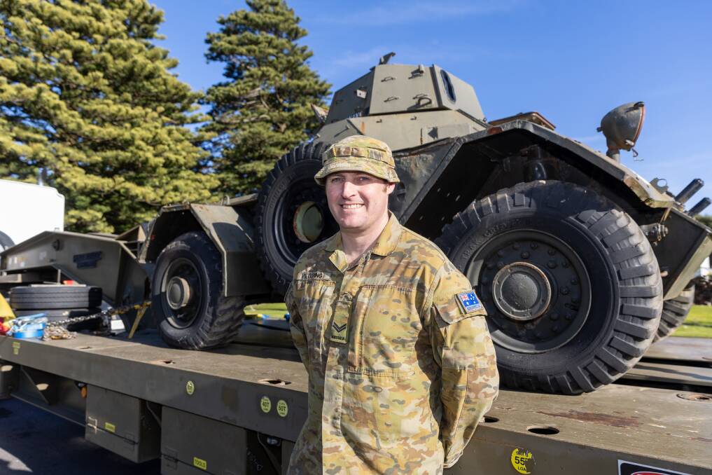Corporal Warrick Petering with one of the military vehicles that have arrived in Warrnambool. Picture by Eddie Guererro