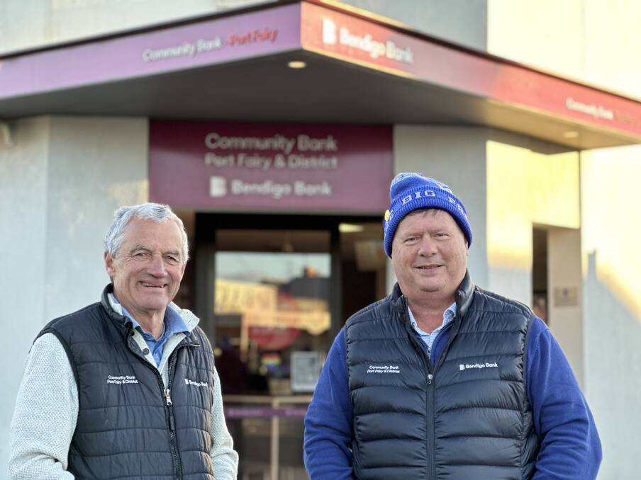 Damian Gleeson and Ashley King prepare to celebrate 10 years of Port Fairy's community bank. Picture by Katrina Lovell 