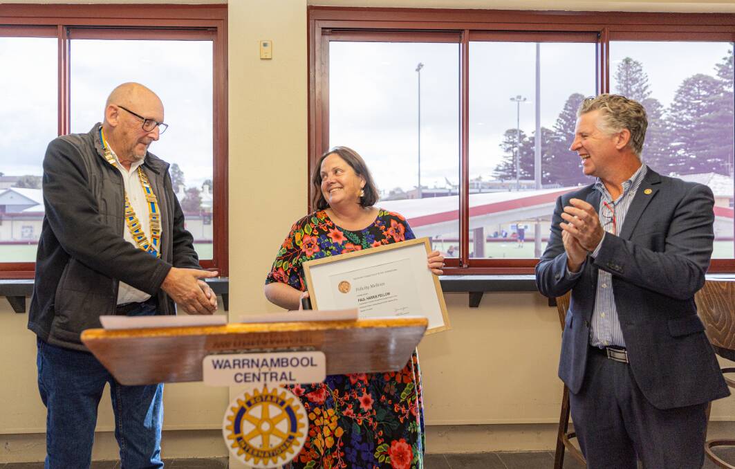 Rotarians Rob Harris and Matthew Northeast present Felicity Melican with a Paul Harris Fellow award. Picture by Eddie Guerrero. 