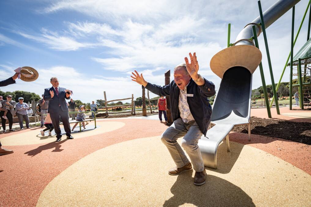 Cr Max Taylor gives Warrnambool's slide a test run when it was officially opened in December. Picture file.