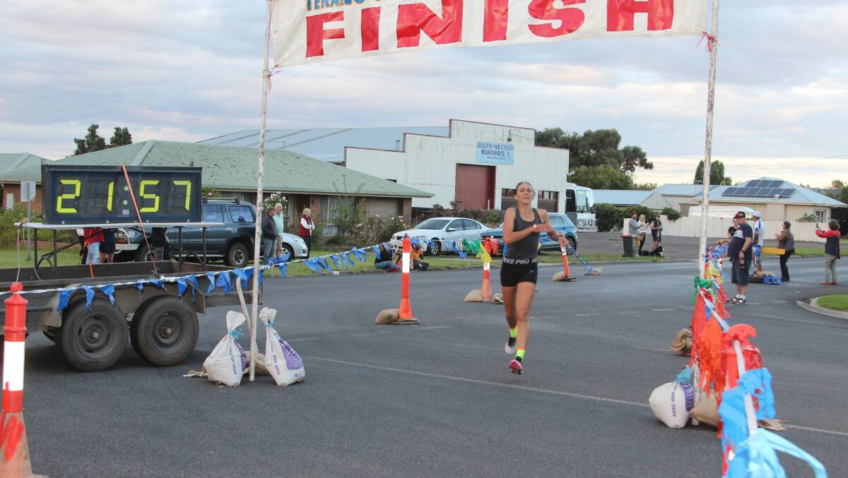 JOB DONE: Anna Kasapis crosses the finish line outside Terang RSL. Picture: Raymond Worland