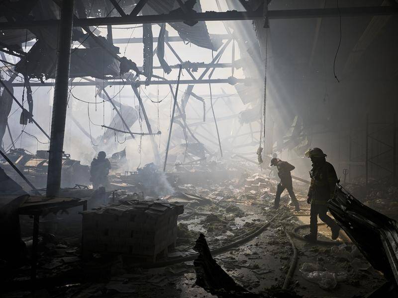 Authorities say about 50 people were at a Kharkiv printing house when it was struck by missiles. (EPA PHOTO)