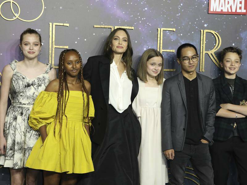 Shiloh Jolie-Pitt (left, with mother Angela Jolie and siblings) filed a notice in The LA Times. Photo: AP PHOTO