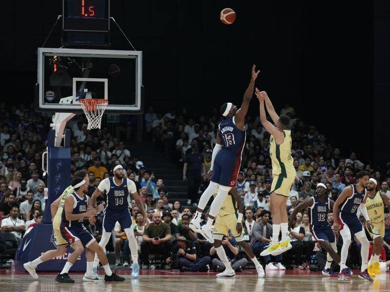 Bam Adebayo tries to block as Boomers' Dante Exum shoots in the Olympic warm-up against the US. (AP PHOTO)