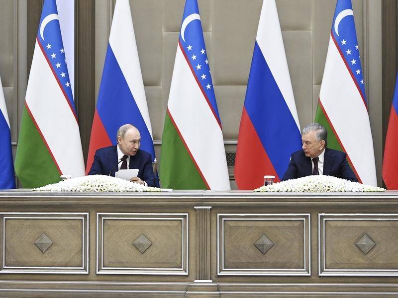 Russian President Vladimir Putin and Uzbek President Shavkat Mirziyoyev deliver a joint statement. (AP PHOTO)