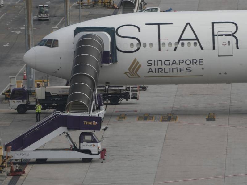 A Boeing 777 diverted to Bangkok after striking deadly turbulence has returned to Singapore. (AP PHOTO)