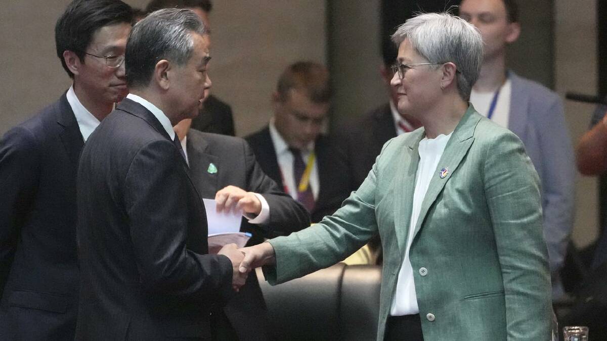 Foreign Affairs Minister Penny Wong met Chinese counterpart Wang Yi at the summit in Laos. (AP PHOTO)