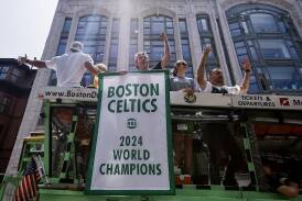 Boston Celtics players soak up the applause during the team's NBA Championship parade last month. (EPA PHOTO)