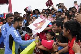 India's Rishabh Pant signs autographs before his side's match with Canada was called off. (AP PHOTO)