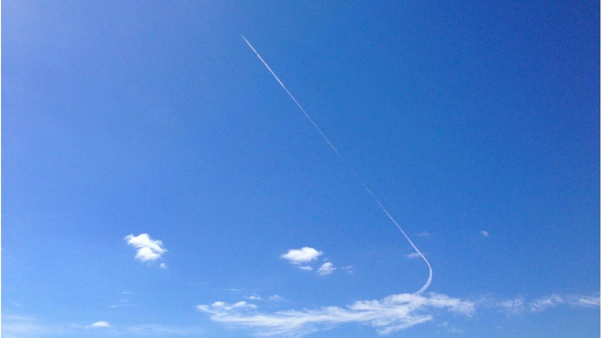 Brett Campany from Wild Blue Helicopters in the Margaret River region of Western Australia took this photo of the contrails of a search plane flying overhead this afternoon en route to the possible site where debris potentially from missing flight MH370 was found.