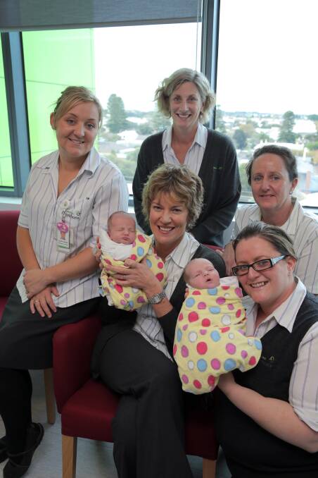Jessica Porter (left), Janene Facey with three-week-old Roux Myers, Louise Jacobs, Cherie Phillips holding three-week-old Orla Myers, and Donna Mahony celebrate International Midwives’ Day. 150505RG02 Picture: ROB GUNSTONE
