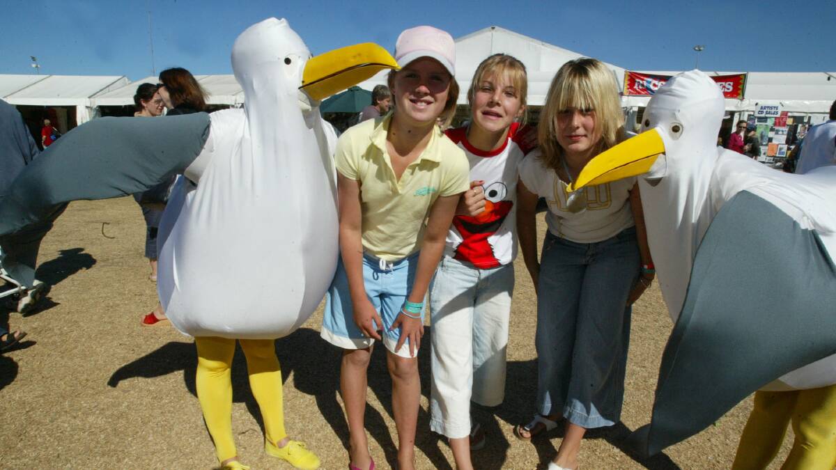 Nikki Allan, 11, Jessica Burke, 13, Elly Webb, 13, from Barwon Heads at the Port Fairy Folk Festival with the Giant Seagulls. 