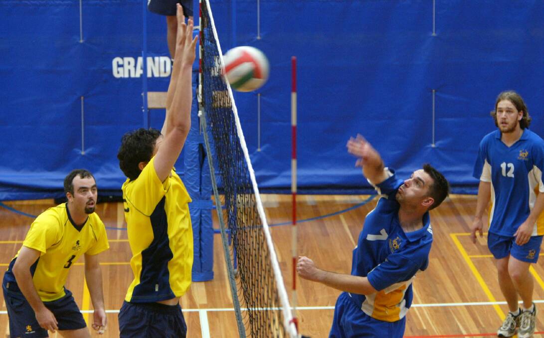 Warrnambool volleyball captain/coach Greg Best hits a ball against USC Lion Adelaide in the Division 1 semi-final.