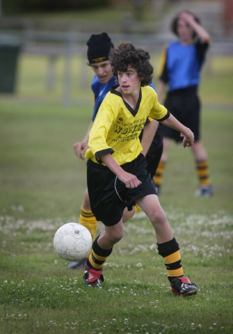 Warrnambool Wolves U/15 soccer academy player Liam Moloney in action at training.