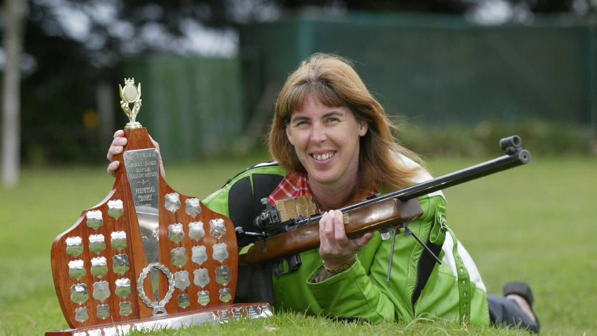 Port Fairy small bore rifle State champion Julie Holcombe with the '50 metre Championship 60 shot English match'  Victorian small bore rifle association Perpetual trophy.