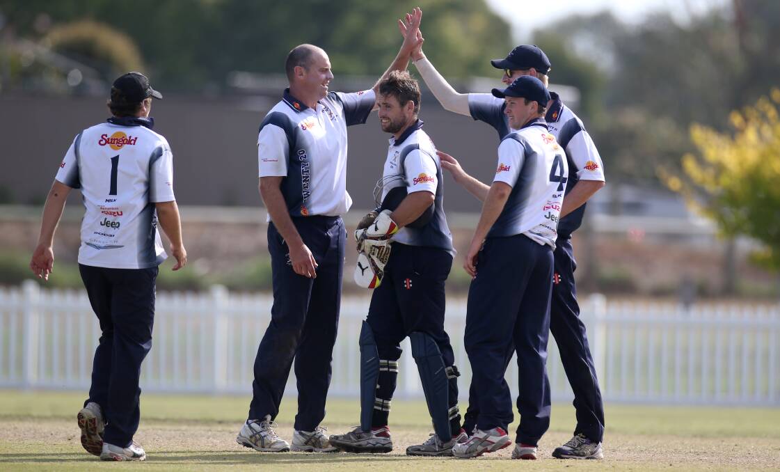 SUCCESS: Port Fairy celebrates its win as the final wicket falls in the Twenty20 final on Tuesday. Picture: Amy Paton