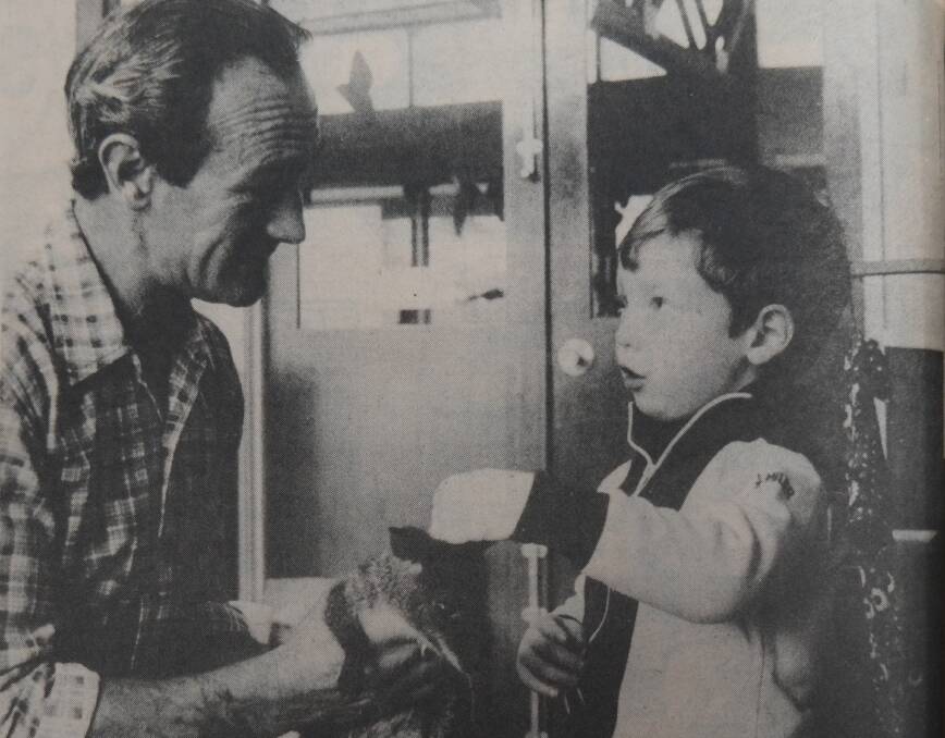 Barry Searle shows Luke Peyton a wallaby in 1979. File Picture