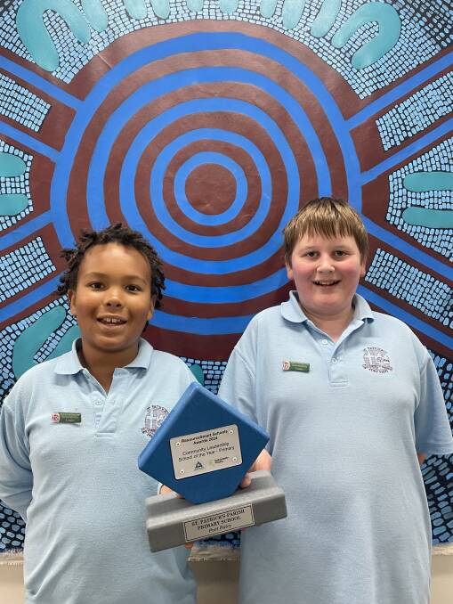 School sustainability leaders Kolo Sakate and Ben Mirtchin with the award. Picture supplied