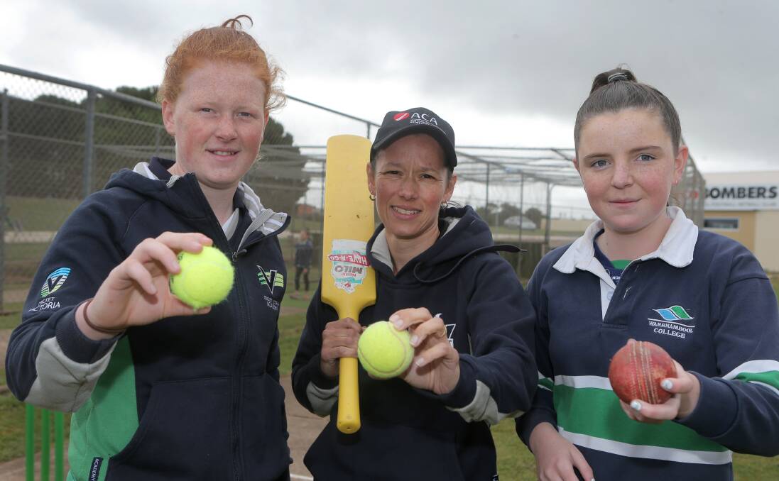 HAVING A BALL: Port Fairy cricketer Rosie Wynd, Vic Spirit cricketer Megan Pauwels and Gabrielle Lenehan, 14, at the girls' cricket clinic at Reid Oval on Wednesday. More than 30 girls attended the cricket clinic. Picture: Amy Paton