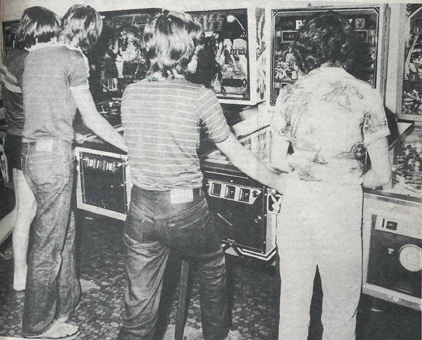 Pinball players in action at Geoff's arcade games in Warrnambool in the 1980s. File picture 