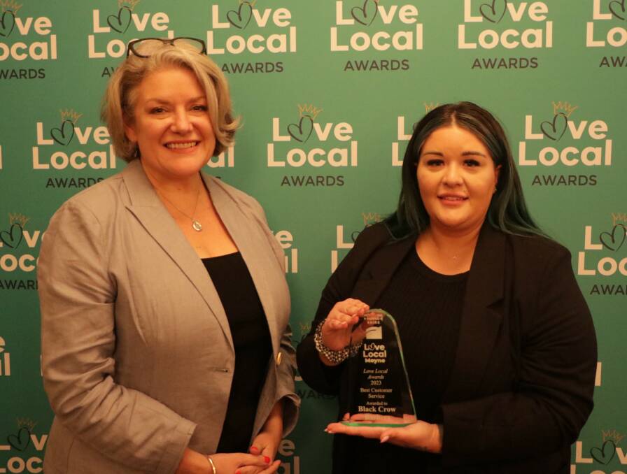 Moyne Shire mayor Karen Foster presents the Love Local award to Kayla Grant from Black Crow Barbers in Koroit. 