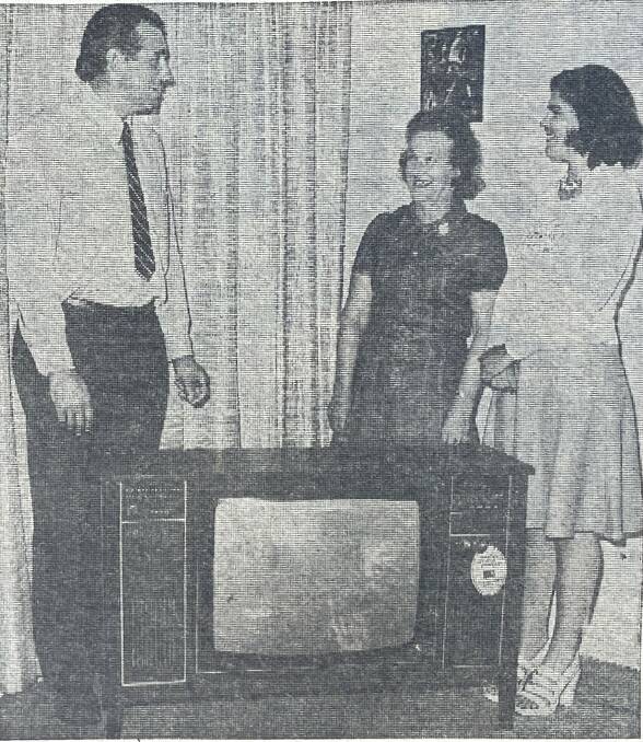 David Rootsey presents Mrs Eric Williams and her daughter Carolyn with a colour television the family won in a Koroit Apex and Lions clubs raffle in December 1974. File picture