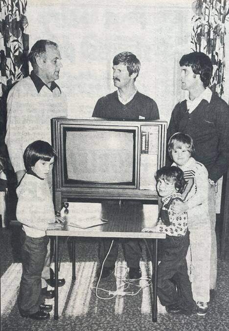 Yalundah Day Training Centre president Jack Daffy and students at the centre, Mathew, Christopher and Billy, accept the donation of a colour television from Warrnambool Kiwanis Club president Ken Chandler and secretary Ian McLean in May 1978. File picture