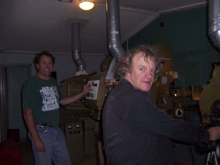 John Gunn operating the Koroit Theatre projectors with Tim Sherwood in 2008. Picture by Anthony Brady