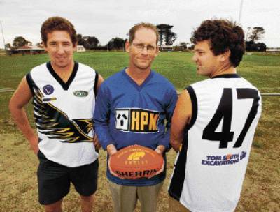 North Warrnambool Eagles coach Leigh McCluskey (centre) and players Michael Darmody (left) and Josh Parkinson model the new away strip. 080409GW09 Picture: GLEN WATSON