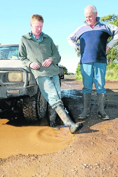 Bessiebelle farmers Ross Kelly and Kevin Bourke are upset at the state of the Woolsthorpe-Heywood Road.