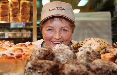 Lois Morrow holds a chocolate mud scone at  Bakers Delight.090930am12   Pictures: ANGELA MILNEWarrnambool Chocolate Week.Pictured  Bakers Delight shop assistant Warrnambool Chocolate Week.Pictured