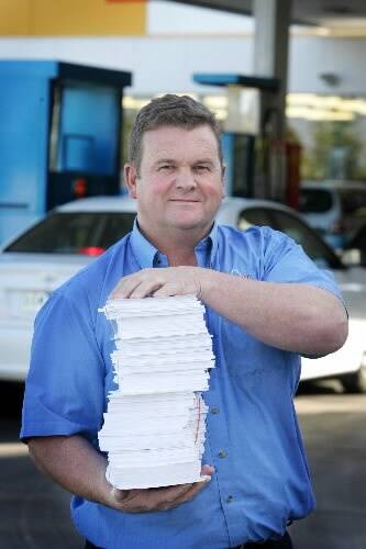Warrnambool APCO service station proprietor Edgar Tanner with the petition forms. 080611AM03 Picture: ANGELA MILNE