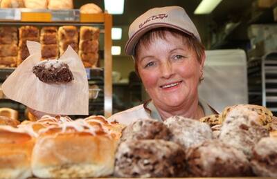 Warrnambool Chocolate Week.Pictured  Bakers Delight shop assistant Lois Morrow, holding a chocolate mud scone.        090930am14   PICTURE: ANGELA MILNE