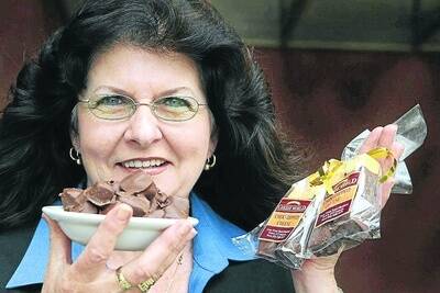 Cheese hostess Julie Carney, holding choc-dipped cheese.090930am24 Warrnambool Chocolate Week.Pictured from cheese world, c   PICTURE: ANGELA MILNE