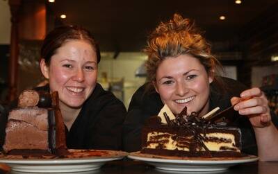 Warrnambool Chocolate Week.Pictured from Images Restaurant cafe and cocktail bar -  Casey Romein holding a  chocolate mountain moussecake and  Therese Freeman holding a  chocolate cheesecake.      090930am17  PICTURE: ANGELA MILNE