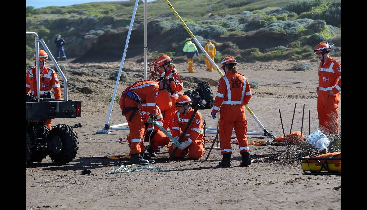 SES workers prepare a winch at Thunder Point.
