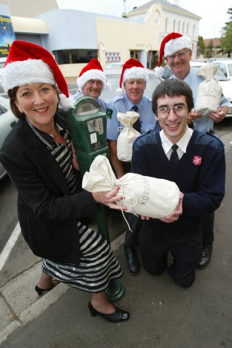 Warrnambool mayor Glenys Phillpot with parking meter men Brian Urwin, Jim O'Meara and Peter McArdle, give a generous donation to Salvation Army welfare worker Chris Philpot.