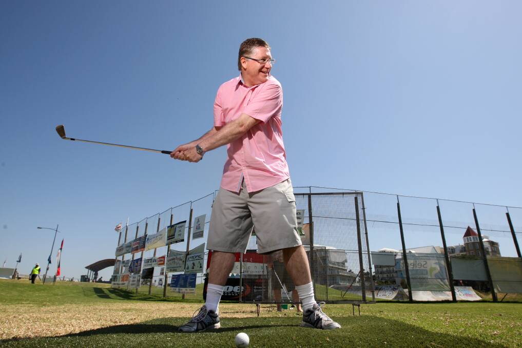 Premier Denis Napthine has a swing at Rotary's Hole In One competition. Picture: VICKY HUGHSON