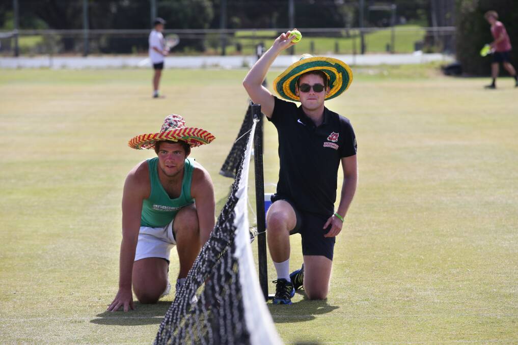 Jarrod and Joshua Stafford from Mortlake act as ball boys between sets in B grade of the Warrnambool Lawn Tennis Club Country Week Tournament. Picture: DAMIAN WHITE